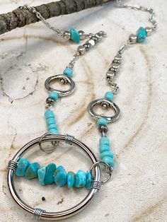 Long turquoise and silver necklace, with wire-wrapped turquoise center hoop pendant. Silver Long Necklace, Wire Wrapped Turquoise, Jewelry Rustic, Jewelry Turquoise, Southwest Jewelry, Long Silver Necklace, Rustic Jewelry, Rustic Boho, Western Jewelry