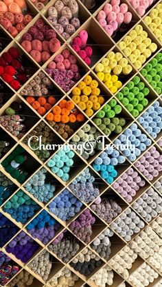 many different colored crochet beads are arranged in the shape of a square rack