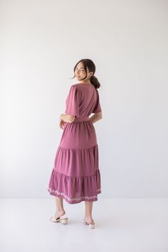 Add a touch of bohemian flair to your wardrobe with the 'Misti' embroidered midi dress! This tiered midi dress has a subtle embroidered detail and brings some color back into your closet. Pair with low heels and a clutch for a charming wedding guest look! 100% Polyester Lining, 100% Polyester Shell Fully Lined Hand Wash Cold Hang or Lay Flat to Dry Do Not Bleach FINAL SALE: NOT ELIGIBLE FOR RETURN OR EXCHANGE Model Height 5'7" | Wearing Size Small Please carefully measure a similar item before p Embroidered Midi Dress, Wedding Guest Looks, Tiered Midi Dress, Layered Tops, Skirt Leggings, Tops For Leggings, Blouse Dress, Low Heels, Summer Collection