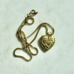 "This necklace is handmade by me and features all vintage components. The necklace chain is a vintage solid brass box chain that is 16\" in length with a functioning heart locket that is 0.79\" x 0.9\" in size. Please note the metal components are raw brass and as such, it is best to avoid humid environments or water exposure which can cause the brass to tarnish. There are brass cleaners available that assist with restoring the natural finish." Vintage Heart Locket, Brass Box, Chain Heart, Heart Locket Necklace, Locket Pendant Necklace, Locket Charms, Vintage Heart, Heart Locket, Locket Necklace