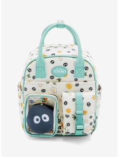 a white and blue backpack with an animal design on the front, it has a small bag