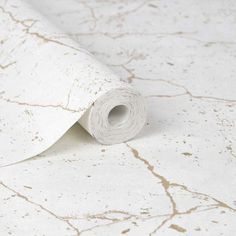 a roll of white marble paper sitting on top of a table