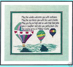 a cross stitch pattern with three hot air balloons