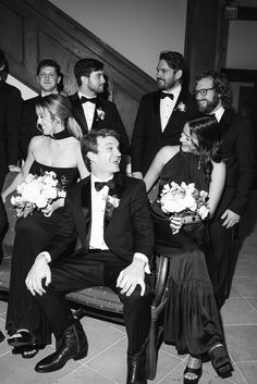 a group of men and women dressed in tuxedos