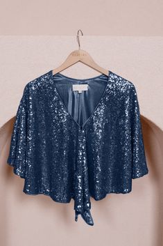 For the moms in the party or anybody that wants a little bit more arm coverage, our sequin shawl is the perfect solution. With several ways to style it, you can find the best look for you. It comes in any of our sequin colors and will complement any dress