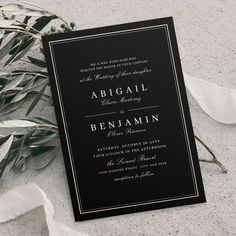 an elegant black and white wedding card