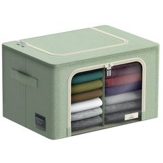 a green storage box filled with folded clothes