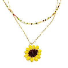 Nothing says fall like bright yellow sunflowers! (Mirasol in Spanish) Always a Joy-Creator favorite, the Mirasol necklace is a two piece, layered stunner. The shorter 16 inch strand is beaded with burgundy, olive green, peach, yellow, white and cream seed beads. And the longer 18 inch strand is a gold plated cable chain with a 1 inch sunflower pendant made from yellow oblong faceted crystals for the petals and a cluster of warm brown seed beads for the center sunflower seeds wired together with Yellow Sunflowers, Sunflower Pendant, Yellow Sunflower, Jewelry Design Necklace, Warm Brown, Black Friday Shopping, Sunflower Seeds, Faceted Crystal, In Spanish