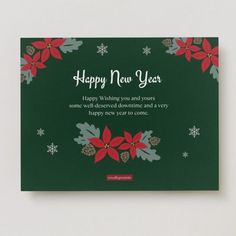 a green christmas card with poinsettis and snowflakes on the front