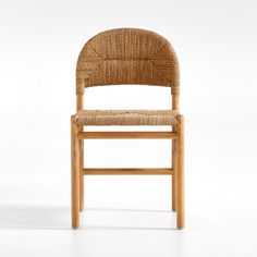 a wooden chair with a woven seat and back rest on a plain white surface,