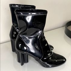 Shaft: 7 In Heel: 3 In Outsole: 8.5 In Patent Leather In Black. The Boots Feature A 3.5-Inch Heel In The Shape Of A Monogram Fleur And A Zipper At The Instep. Worn But Still In Good Condition. Size 39.5 Shoes Louis Vuitton, Louis Vuitton Black, A Monogram, Louis Vuitton Shoes, 5 Inch Heels, Patent Leather, Bootie Boots, Ankle Boots, Louis Vuitton