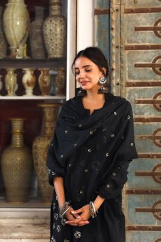 The set consists of a black straight cut kurta, 3/4th sleeves, round neck, knee length teamed with straight pants and a dupatta to match. The entire set has beautiful taari work. Suit Fabric-Cotton Dupatta Fabric-Cotton Doria Kurta Length-38 inches Pant Length-36 inches The model is wearing size small. Washing Care-Cold Wash Separately Kurta Palazzo Set, Black Kurta, Palazzo Set, Cotton Dupatta, Pant Length, Suit Fabric, Straight Pants, Straight Cut, Fabric Cotton