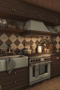 a kitchen with an oven, sink and stove top in front of a counter that has pots and pans on it