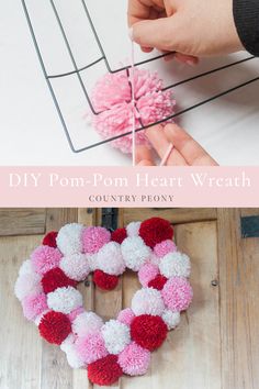 someone is making a pom - pom heart wreath out of yarn