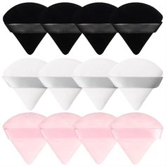 six heart shaped makeup sponges in different colors and shapes, with one black pink white and the other light pink