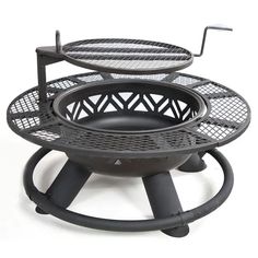 an outdoor fire pit sitting on top of a metal stand with two trays attached to it