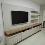 a large flat screen tv mounted to the side of a wall