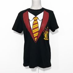 a harry potter t - shirt with a tie and hogwarts crest on it