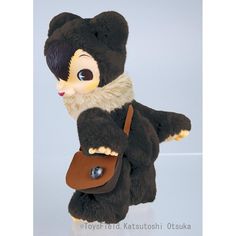 a stuffed bear with a brown purse on its back legs and eyes are shown in front of a white background