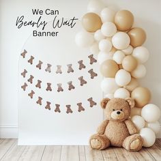 a teddy bear sitting in front of a bunch of balloons with the words we can beauty what banner