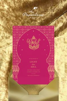 a pink and gold wedding card with an ornate design on the front, in metallic foil