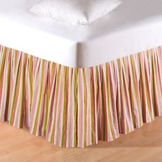 the bed skirt is made with multicolored stripes