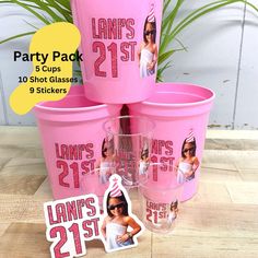 pink plastic cups with photos on them and stickers in front of the cup is an advertisement for lanps 21st birthday party pack