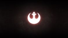 the star wars symbol is glowing in the dark