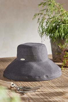 Handmade from lightweight and breathable cotton and branded with terrain exclusive details, this colorful crusher hat is perfect for a day at the beach or in the garden. Packable construction pairs with UPF 50 sun protection and an inner drawstring to assure a comfortable fit. | Cotton Crusher Hat in Grey at Terrain Lightweight Summer Bucket Hat With Upf 50+, Lightweight Summer Bucket Hat For Vacation, Lightweight Upf 50+ Bucket Hat For Spring, Beach Bucket Hat Upf 50+, Lightweight Upf 50+ Bucket Hat For Vacation, Lightweight Upf 50+ Bucket Hat For Beach, Lightweight Upf 50+ Bucket Sun Hat, Spring Travel Bucket Hat In Cotton, Spring Travel Bucket Hat Made Of Cotton