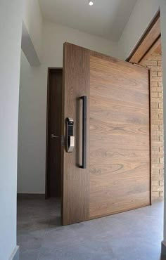 the door is made of wood and has a metal handle on it's side