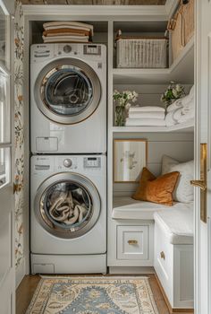 a washer and dryer sitting in a closet next to each other on top of a rug