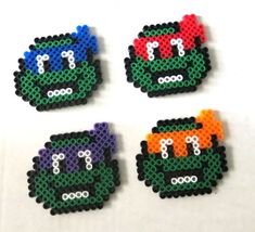 four pieces of perler bead art depicting teenage mutant turtles in different colors and sizes