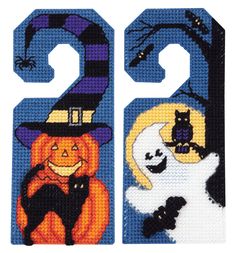 two halloween door hangers with pumpkins, ghost and cat in the night sky