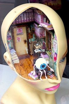 a mannequin's head with an image of a room in the shape of a human head