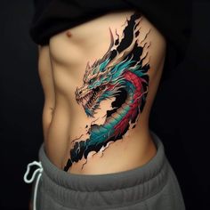 a woman's stomach with a dragon tattoo on the side and an upper part