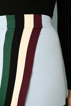 ONLY 1 LEFT - FINAL SALE! Stripes have always been a signature look and this cool multi color stripe detail is a thread throughout the entire Fall collection. This Pool Tile mini wrap skirt has an elastic waist band, a flirty overlap and the softest feel. Pair it with any of the solid tops or the matching striped crop for a total Joos look. Our custom-dyed eco-merino fabrication is a combination of biodegradable extra-fine merino wool, plant-based viscose and recycled Lycra. It’s just as soft as Striped Skirt Outfit, Mini Wrap Skirt, White Striped Skirt, Fabric Shaver, Mini Wrap, Pool Tile, Signature Look, Fall Collection, Solid Tops