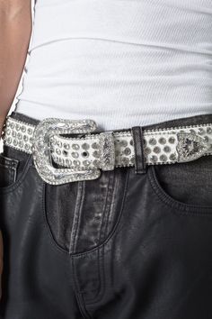 The All Over Rhinestone Studded Belt is made from black leather and features intricate Western design motifs on the metal buckle, end tip and loop, with red rhinestone embellishment throughout. Design Details 100% leather metal buckle and trims S/M fits waists 32" - 36" M/L fits waists 36" - 40" Studded Belt Outfit, Rhinestone Belts, Design Motifs, Rhinestone Belt, Western Design, Studded Belt, Denim Patchwork, Rhinestone Studs, Red Rhinestone