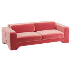 a pink couch sitting on top of a white floor