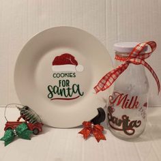 a white plate sitting on top of a table next to a bottle of milk and christmas decorations