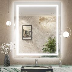 a bathroom sink sitting under a mirror next to a vase with flowers on top of it