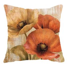 an orange and yellow flower pillow on a white background with the image of three poppies