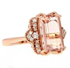 6.35 Carats Exquisite Natural Morganite and Diamond 14K Solid Rose Gold Ring Suggested Replacement Value: $6,500.00 Total Natural Emerald Cut Morganite Weights: Approx. 6.00 Carats Morganite Measures: Approx. 12.00 x 10.00mm Natural Round Diamonds Weight: Approx. 0.35 Carats (color G-H / Clarity SI1-SI2) Ring total weight: Approx.6.5 grams Disclaimer: all weights, measurements and colors are approximate and may vary slightly from the listed dimensions or as seen in the image. All pictures are ma Elegant Pink Gold Rings With Accent Stones, Luxury Rose Gold Rings With Accent Stones, Luxury 14k Rose Gold Jewelry With Halo Setting, Elegant Pink Gold Jewelry With Center Stone, Luxury Rose Gold Diamond Ring With Gemstone, Formal Rose Gold Morganite Diamond Ring, Elegant Pink Gold Rings, Elegant Pink Gold Morganite Rings, Exquisite Rose Gold Rings For Formal Occasions