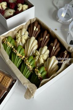 a box filled with assorted chocolates and flowers