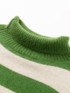 Details: Striped sweater in rich grass green fused with white color scheme High neck design, both practicality and sense of style Green and white stripe color clash, visually fresh and clean Loose hemline with ribbed edging Materials & Care: Other Specialty Animal Hair 100%(with traces of other fibers) Do not wash, gentle dry clean Do not bleach Size & Fit: Model is 5'7", Bust 32, Waist 24, Hips 35, wearing a size S Item #: JM3KT02 Green Knit Sweater With Ribbed Collar, White Striped Hem Sweater For Fall, Green Turtleneck Sweater With Ribbed Cuffs, White Striped Hem Sweater For Winter, White Knit Sweater With Contrast Stripes, Green Turtleneck Top With Ribbed Cuffs, Winter Knit Tops With Striped Hem, Winter Knit Top With Striped Hem, Knit Tops With Striped Hem For Winter