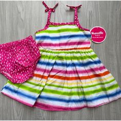 Prepare Them To Make A Pretty Impression When Temperatures Climb By Dressing Them In This Striped Sleeveless Dress That Flaunts Contrast Dotted Fabric Along Bow-Capped Straps. Matching Bloomers Keep Their Diaper Sweetly Under Wraps. Includes White Multicolor Stripe Sleeveless Dress And Pink Polka Dot Bloomers (Two Pieces Total) 100% Cotton Machine Wash; Tumble Dry Imported Features: Sundress, Bloomers Size: Babys 12m Condition: New With Tags Playful Multicolor Sleeveless Summer Dress, Playful Multicolor Sleeveless Dress For Spring, Multicolor Sleeveless Dress For Summer Playtime, Playful Sleeveless Sundress, Playful Sleeveless Sundress For Playwear, Playful Multicolor Sleeveless Sundress, Playful Sleeveless Sundress For Play, Multicolor Sleeveless Sundress For Playtime, White Summer Sundress For Playtime