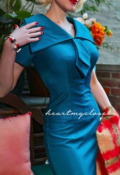 Mad Men TV show inspired dress dress Vintage style classic V-neckline with wide collar Arrow-shaped ties at the front Fully lined Model wears teal Be a femme-fatale in purple in a body-hugging wiggle dress. The bodice is stunning with a V-neckline framed by a dramatic wide pointed collar. Bold, but feminine arrow-shape Fitted Knee-length Retro Dresses, Fitted Dresses In 1950s Style For Formal Occasions, 1950s Style Fitted Formal Dresses, Retro Fitted Dresses, 1950s Style Dresses For Dressmaking, Classic Fitted Dresses For Vintage Fashion, Fitted Knee-length Dress For Vintage Fashion, Fitted Dresses With Notched Neckline For Evening, Fitted Knee-length Retro Mini Dress