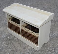 a white bench with two baskets on the top and one basket below it that has shoes in it