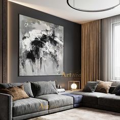 a living room filled with furniture and a painting on the wall