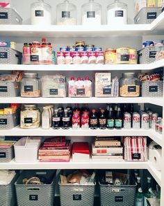 an organized pantry filled with lots of food and drink items, including canned foods in containers