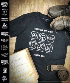 an image of a t - shirt that says armor of god game on with shoes and book